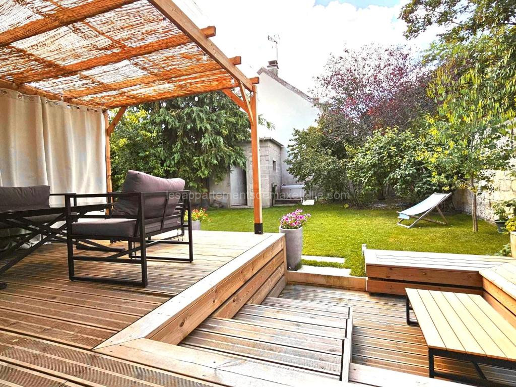 Photo de Grande maison de charme avec jardin